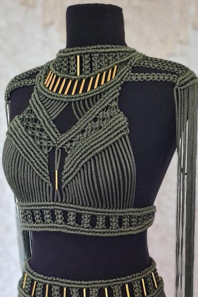 Mannequin wearing a olive and gold beaded top with fringe details